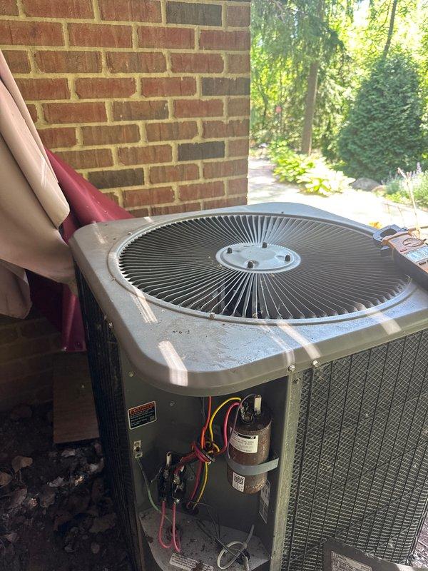 Completed comprehensive Gold AC Inspection and tune-up on residential air conditioning system as part of plan membership maintenance. Performed full system evaluation including inspection of outdoor condenser unit, capacitor, electrical connections, and all accessible components. Verified proper operation of fan motor, compressor, and controls. Checked refrigerant levels, cleaned condenser coils, and inspected all wiring connections for signs of wear or damage. System found to be operating within normal parameters with no immediate repairs required. Unit is positioned in landscaped area with adequate clearance and airflow around condenser. All safety checks passed and system is ready for continued seasonal operation.