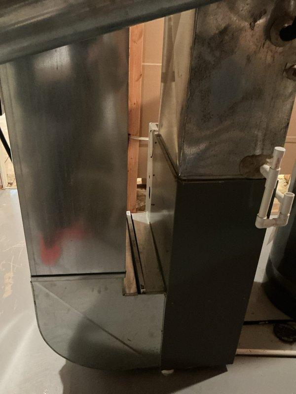 Conducted on-site assessment for HVAC system replacement in basement mechanical room. Evaluated existing 19-year-old furnace and air conditioning system, documented current equipment configuration including water heater placement, PVC condensate drainage lines, and existing ductwork connections. Photographed equipment layout and provided comprehensive replacement quote for new furnace and air conditioner installation.