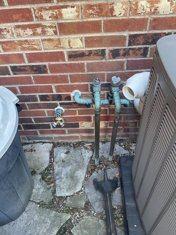 Conducted on-site evaluation of existing plumbing infrastructure to provide estimate for battery backup sump pump installation. Inspected exterior water supply lines with shutoff valves and interior basement plumbing system including copper supply lines with isolation valves. Documented current conditions of outdoor hose bibs, main water connections, and basement water distribution system. Photographed existing plumbing configuration to develop comprehensive proposal for backup pump system integration with current infrastructure.