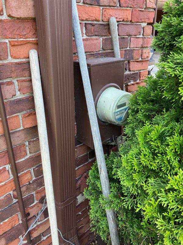Completed full system replacement estimate for 22-year-old furnace with cracked primary heat exchanger and 20-year-old R22 air conditioning unit experiencing abnormal operational sounds, overheating issues, and failing outdoor fan motor bearings. Assessed existing equipment located at basement level with outdoor condenser positioned on concrete pad adjacent to brick exterior wall. Documented current system conditions and provided comprehensive replacement options for complete HVAC system upgrade.