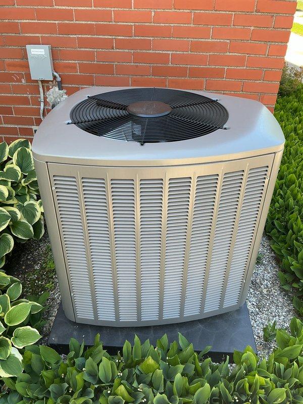 Completed Gold AC inspection on residential cooling system with outdoor condensing unit and basement air handler. Performed comprehensive evaluation of equipment operation, verified system functionality, and conducted visual inspection of condenser unit positioned on pad against exterior brick wall. Delivered complimentary air filter as part of Gold maintenance program, confirmed unit operating properly with clean, well-maintained exterior surfaces and proper clearances from surrounding landscaping.