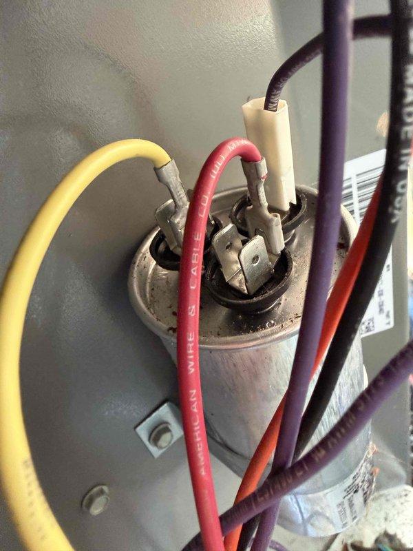 Completed comprehensive Gold AC inspection on 2-year-old residential split system with air handler located in basement. Performed full system evaluation including visual inspection of outdoor condensing unit with fan assembly, verified proper capacitor connections and electrical components, checked refrigerant lines, and confirmed all equipment operating within normal parameters. Both units found in good working condition with no deficiencies noted.
