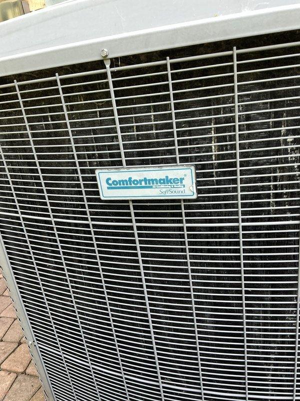 Completed comprehensive Gold AC inspection on a 6-year-old Comfortmaker SoftSound air conditioning system with air handler located in basement. Performed thorough examination of outdoor condenser unit, verified proper operation of all components, inspected condenser coils and protective grille, checked refrigerant lines, and confirmed system functionality. Unit found to be operating within normal parameters with no immediate service needs identified.