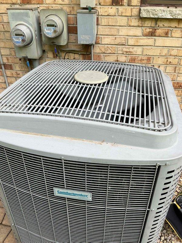 Completed comprehensive Gold AC inspection on a 6-year-old Comfortmaker SoftSound air conditioning system with air handler located in basement. Performed thorough examination of outdoor condenser unit, verified proper operation of all components, inspected condenser coils and protective grille, checked refrigerant lines, and confirmed system functionality. Unit found to be operating within normal parameters with no immediate service needs identified.