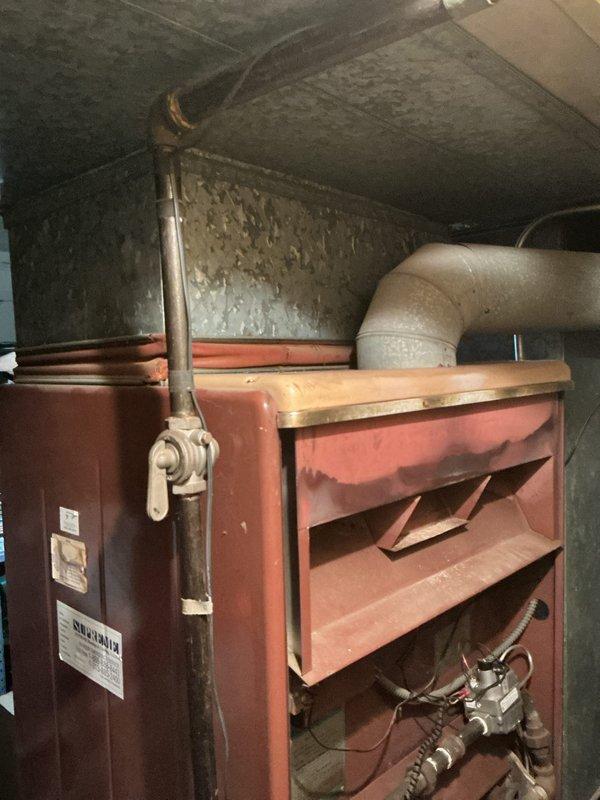 Conducted comprehensive assessment of basement HVAC system for air conditioning replacement estimate. Evaluated existing natural gas furnace, ductwork plenum showing significant dust accumulation and age-related wear, and associated ventilation components to determine compatibility requirements and installation parameters for new AC unit integration with current heating system.