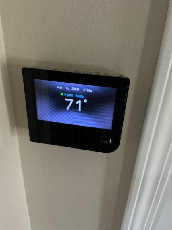 Completed comprehensive Gold AC Inspection on 3-year-old Bryant HVAC system located in basement. Performed full system evaluation including inspection of furnace unit, ductwork connections, PVC drainage and venting lines, and verified proper thermostat operation with system maintaining 71°F room temperature. All components found to be functioning properly with no immediate service needs identified at time of inspection.