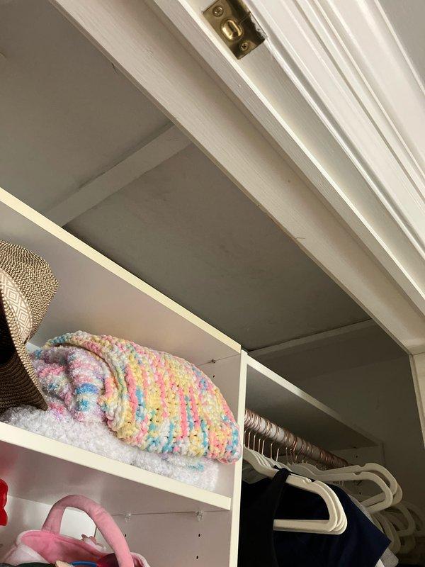 Responded to service call for non-cooling air conditioning system with active refrigerant leak located in attic space with extremely limited access. Ten-year-old system had completely failed, with history of water leakage through ceiling from previous season. Performed comprehensive system evaluation in confined attic installation, documented tight clearances and access constraints with measurements, and assessed air handler condition and leak source. Provided complete equipment replacement estimate due to age of system, active leak, and accessibility challenges for repair work.