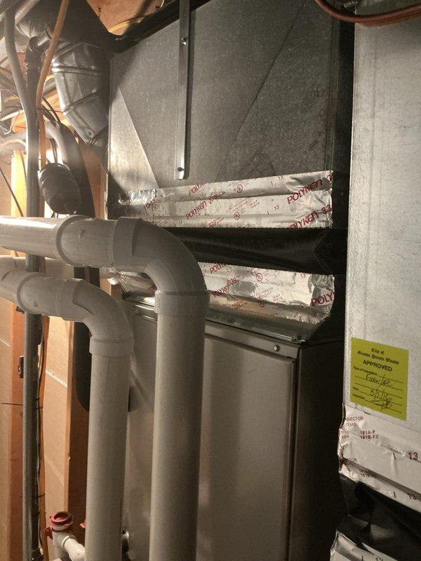 Responded to service call for air conditioning system not turning on, affecting whole house. Evaluated 13-year-old outdoor AC unit and existing indoor air handler system. Provided comprehensive replacement estimate for complete HVAC system upgrade, documenting current equipment conditions including air handler cabinet, ductwork connections, PVC condensate drainage lines, and electrical wiring configurations to support equipment replacement recommendations.