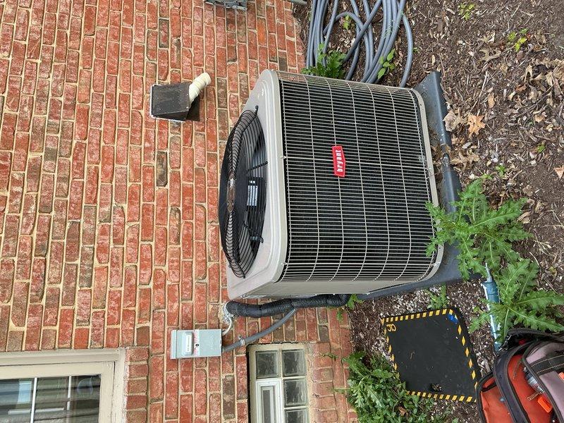 Completed annual air conditioning inspection and tune-up on 4-year-old Bryant condensing unit located on exterior brick paver patio with evaporator coil in basement. Performed standard maintenance protocol including system performance verification, refrigerant charge assessment, and electrical connections inspection. Sealed electrical penetration point at exterior wall where conduit enters structure to prevent moisture infiltration and pest entry, addressing weatherization concern identified during initial service request.