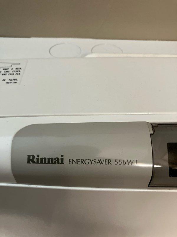 Evaluated existing 12-year-old Rinnai ENERGYSAVER 556WT gas wall heater that is not functioning properly. Documented equipment dimensions and current condition with photographs to provide replacement estimate. Unit shows standard wear consistent with age, and customer requires replacement options for natural gas heating appliance.