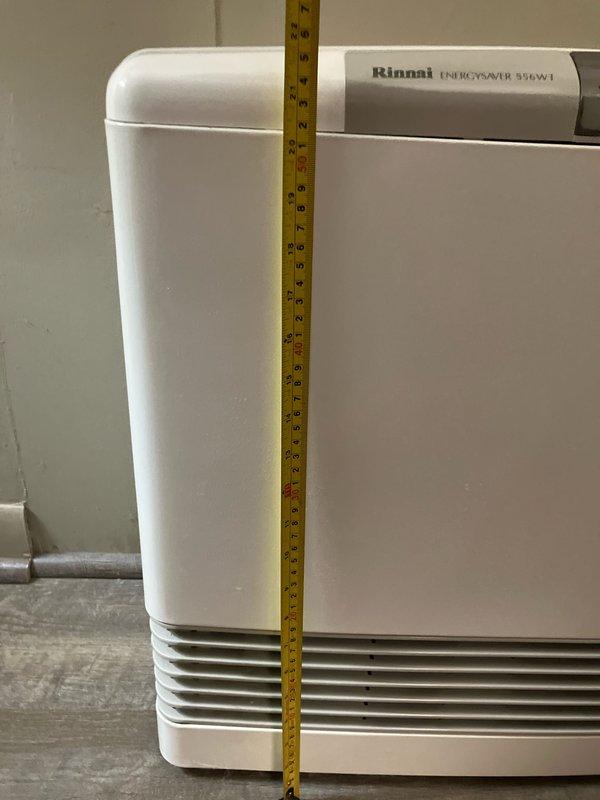 Evaluated existing 12-year-old Rinnai ENERGYSAVER 556WT gas wall heater that is not functioning properly. Documented equipment dimensions and current condition with photographs to provide replacement estimate. Unit shows standard wear consistent with age, and customer requires replacement options for natural gas heating appliance.