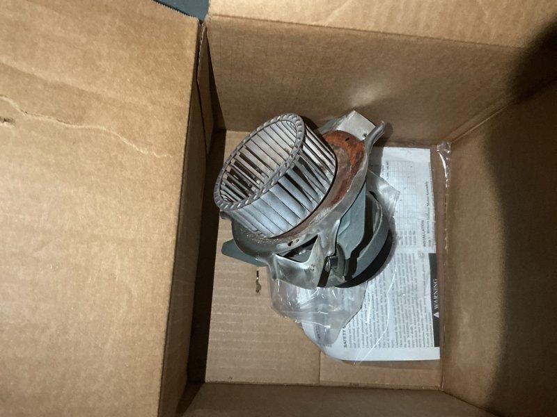 Replaced defective inducer motor assembly on furnace system. The new motor was retrieved from the shop and successfully installed, with all electrical connections properly secured to the control module and wiring harness verified for correct operation.