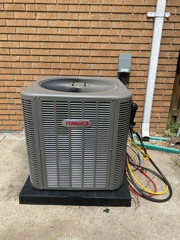 Completed installation of 2.5-ton Lennox air conditioning system with evaporator coil at residential property. The original specified A/C model was unavailable, requiring an upgraded unit substitution that was approved by all parties prior to installation. Unit was positioned on concrete pad with vibration-dampening mount against rear exterior wall. Connected refrigerant lines, established electrical service with disconnect box mounted to structure, and reconnected all necessary components. System was tested for proper operation, airflow, and refrigerant charge. Installation included permit request for mechanical and AC work. All connections secured and system left in full operational status.