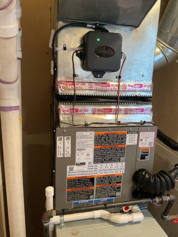 Successfully completed installation of a 2-ton air conditioning system with matching evaporator coil in utility space. Installed new condensing unit with R-454B refrigerant, connected refrigerant lines, and integrated Ecobee 3 Lite thermostat for system control. Performed system flush, established proper drainage with PVC condensate lines, secured all electrical and mechanical connections, and verified operational parameters. All required mechanical, electrical, and air conditioning permits obtained and work completed to code specifications.