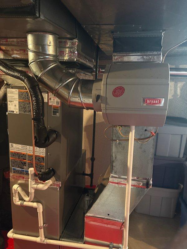 Completed installation of 1.5-ton air conditioning system with matching evaporator coil in basement mechanical room. Installed new air handler unit with integrated coil, connected refrigerant lines, configured PVC condensate drain system with trap and emergency shutoff valve, and completed all ductwork connections to existing plenum. System was pressure tested, evacuated, charged to manufacturer specifications, and verified operational with proper airflow and temperature differential across coil.