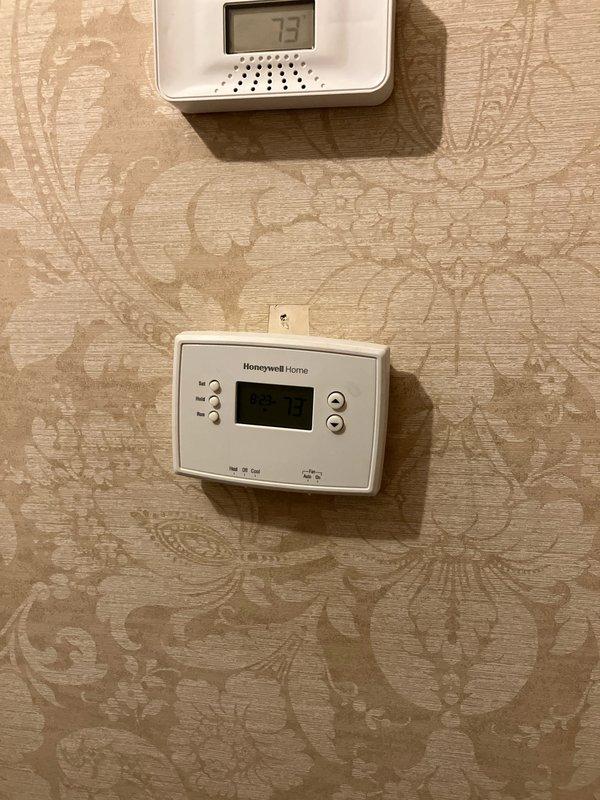 Provided comprehensive estimate for replacement of two aging air conditioning systems, both over 20 years old. Primary attic unit diagnosed with failed capacitor and burnt compressor wiring, while secondary system showed signs of deterioration. Both condenser units located on roof with window access, currently operating on obsolete R22 refrigerant requiring full system replacement rather than repair due to age and component failure.