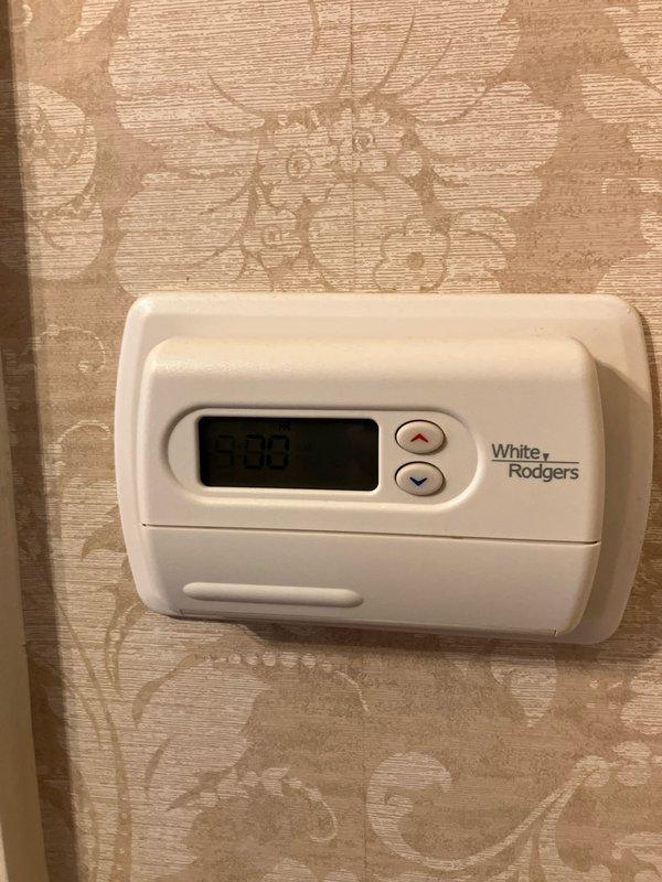 Provided comprehensive estimate for replacement of two aging air conditioning systems, both over 20 years old. Primary attic unit diagnosed with failed capacitor and burnt compressor wiring, while secondary system showed signs of deterioration. Both condenser units located on roof with window access, currently operating on obsolete R22 refrigerant requiring full system replacement rather than repair due to age and component failure.