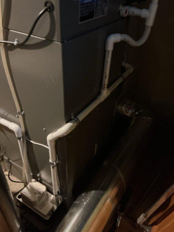 Completed Gold AC Inspection on a one-year-old HVAC system with air handler located in basement. Performed comprehensive maintenance including visual inspection of furnace, air handler unit, condensate drain lines, and ductwork. Verified proper operation of Lennox digital thermostat and Aprilaire humidistat control system. Confirmed all PVC drainage piping connections were secure and functioning correctly. System operating normally with no deficiencies noted at time of inspection.