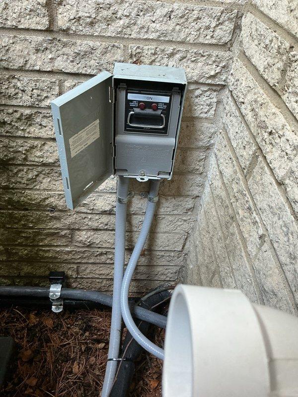 Completed annual cooling system tune-up and preventive maintenance on residential air conditioning unit. System was operating properly upon arrival and confirmed in good working condition throughout inspection. Performed comprehensive evaluation of outdoor condenser unit, including refrigerant line connections, electrical disconnect switch, and all mechanical components. Cleared accumulated debris including pine needles from around unit base and piping assembly to ensure proper airflow and prevent future operational issues. All electrical connections, refrigerant lines with foam insulation, mounting brackets, and disconnect box verified secure and functioning correctly. System tested and left in optimal operating condition for continued reliable performance.