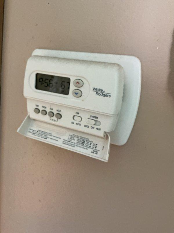 Completed comprehensive Gold AC inspection on a 3-year-old residential air conditioning system. Verified operational status of outdoor condenser unit and indoor thermostat controls, confirmed proper system functionality with equipment operating as designed. Performed standard preventive maintenance inspection protocol, documenting equipment condition through photographic records of the White-Rodgers programmable thermostat and exterior condenser unit with adequate clearance and airflow access.