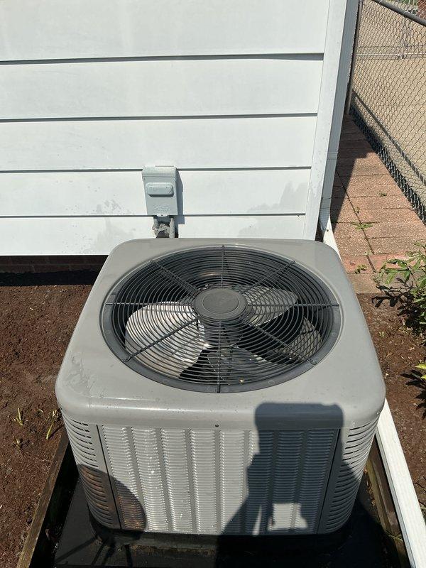 Completed comprehensive Gold AC inspection on a 3-year-old residential air conditioning system. Verified operational status of outdoor condenser unit and indoor thermostat controls, confirmed proper system functionality with equipment operating as designed. Performed standard preventive maintenance inspection protocol, documenting equipment condition through photographic records of the White-Rodgers programmable thermostat and exterior condenser unit with adequate clearance and airflow access.