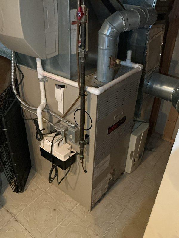 Provided comprehensive replacement estimate for existing 10+ year old natural gas furnace and air conditioning system currently located in basement. Both units are operational but approaching end of serviceable life expectancy. Evaluated current equipment configuration including ductwork, condensate drainage system, electrical connections, and gas supply lines to determine optimal replacement specifications and installation requirements.