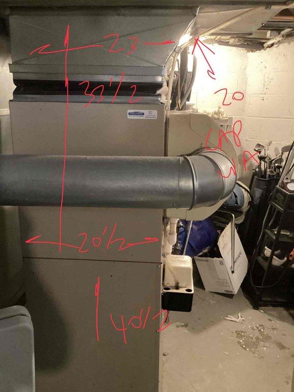 Conducted comprehensive on-site evaluation for complete HVAC system replacement in residential basement installation. Performed detailed measurements of existing ductwork system, including main trunk lines, supply branches, and return air pathways to determine proper sizing requirements for new equipment. Documented current system configuration with dimensional markings on rectangular and cylindrical duct sections, noting measurements ranging from 20.5 to 40.5 inches for accurate replacement planning. Assessed utility space layout, ceiling clearances, and structural constraints to develop optimal equipment placement strategy. Photographed existing installation to support proposal development and ensure accurate material specifications for full system replacement quote.