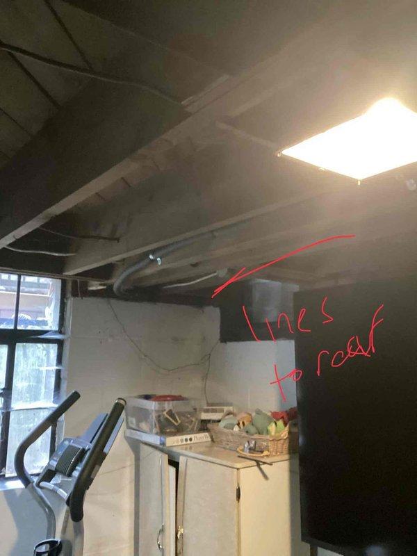 Conducted comprehensive on-site evaluation for complete HVAC system replacement in residential basement installation. Performed detailed measurements of existing ductwork system, including main trunk lines, supply branches, and return air pathways to determine proper sizing requirements for new equipment. Documented current system configuration with dimensional markings on rectangular and cylindrical duct sections, noting measurements ranging from 20.5 to 40.5 inches for accurate replacement planning. Assessed utility space layout, ceiling clearances, and structural constraints to develop optimal equipment placement strategy. Photographed existing installation to support proposal development and ensure accurate material specifications for full system replacement quote.