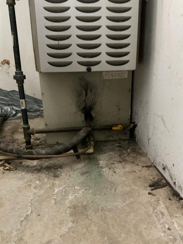 Provided comprehensive estimate for full HVAC system replacement at owner-occupied residence with existing 19-year-old equipment from 2007 currently located in garage. Documented existing indoor air handler unit showing significant wear, dirt accumulation, and staining on concrete floor surface, along with outdoor condenser unit exhibiting extensive rust discoloration on top grille and fan housing, indicating advanced age and weather exposure. Quote prepared for complete system installation to replace aging equipment that has exceeded typical service life expectancy.