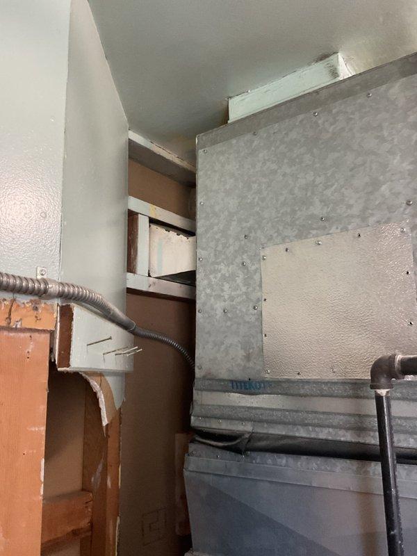 Successfully completed installation of a 2-ton air conditioning system with evaporator coil at rear location. Mechanical and electrical permits were requested and obtained prior to installation. All ductwork connections were secured, electrical reconnection was performed to code, and system was tested for proper operation upon completion.