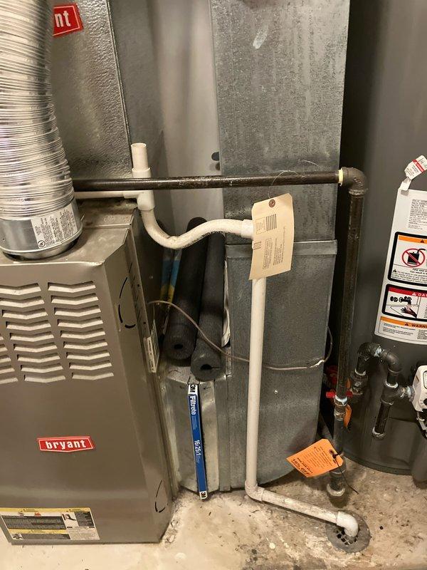 Responded to service call for non-functioning air conditioning system and blank thermostat following power outage damage. Upon inspection, found Bryant furnace and cooling system with Honeywell thermostat displaying no power. Assessed 10+ year old HVAC equipment located in basement for potential power surge damage affecting both heating and cooling components. Evaluated system components including furnace unit, evaporator coil, thermostat controls, and associated electrical connections to determine extent of damage and provided comprehensive estimate for full system replacement due to age of equipment and electrical damage sustained during power outage.