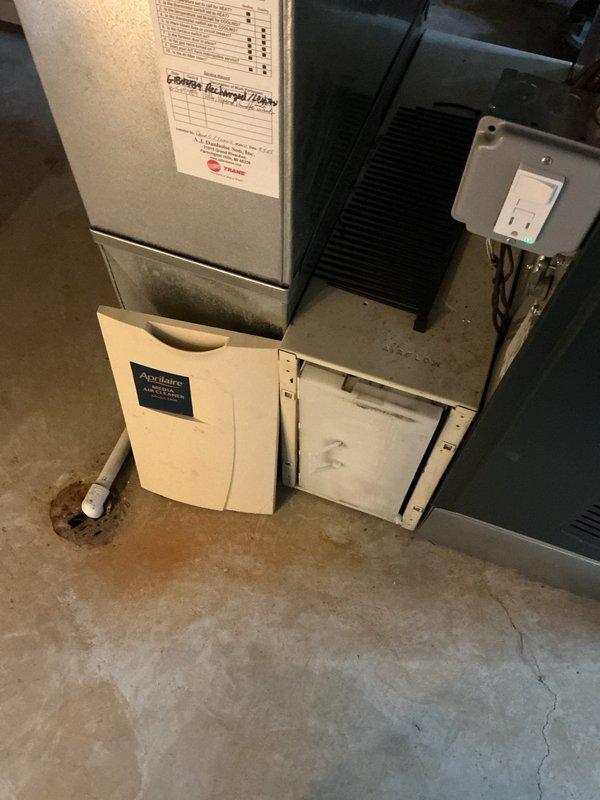 Completed comprehensive tune-up service on 4-year-old furnace and tanked water heater located in basement. Performed full system inspection of HVAC equipment including air handler, ductwork, and Aprilaire humidification component. Conducted combustion analysis testing using Testo 310 analyzer to verify proper furnace operation and efficiency levels, confirming safe combustion parameters. Inspected all accessible components, electrical connections, and filter access panels. Verified proper operation of water heater and documented equipment conditions with photographic records for maintenance history.