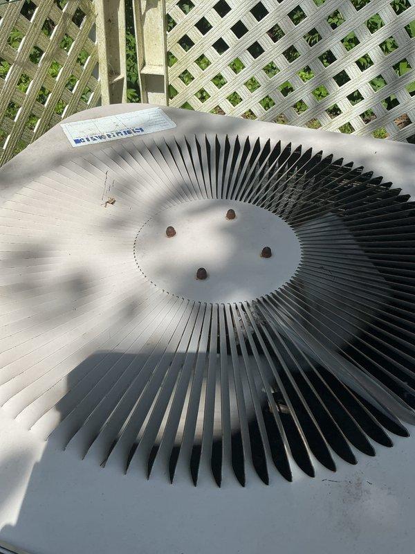 Completed comprehensive Gold AC inspection on two residential air conditioning systems with equipment dating from 1995, 2002, and 2013. Air handlers located in upstairs closet and basement, with condenser units positioned on outdoor wooden deck area. Performed thorough visual inspection of both systems, including examination of condenser fan assemblies, protective grilles, and overall equipment condition. Advised customer that area surrounding condenser units needs to be maintained clear of debris and animal waste to ensure proper airflow and system efficiency. Documented equipment condition through photographic inspection showing condenser fan blades, protective grilles, and outdoor placement. Both systems operational at time of inspection with components showing age-appropriate wear consistent with installation dates.
