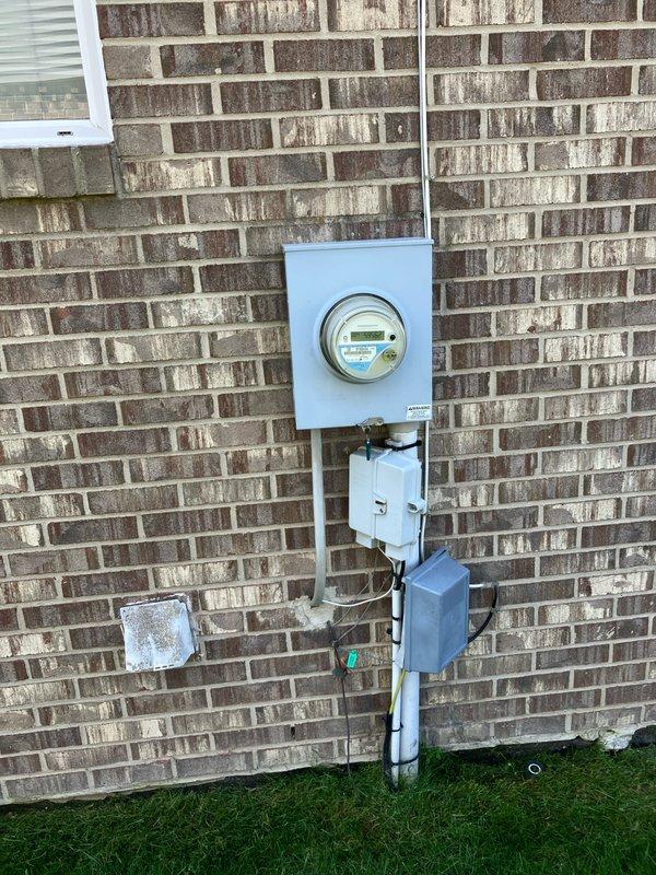 Provided comprehensive estimate for complete HVAC system replacement including non-functional air conditioning unit and natural gas furnace located in basement. Existing equipment over 10 years old with outdoor condensing unit mounted on exterior brick wall connected to weatherproof electrical disconnect box via refrigerant line set. Assessed current installation configuration, electrical service capacity, and existing refrigerant line routing to develop replacement specifications for new high-efficiency cooling and heating system.