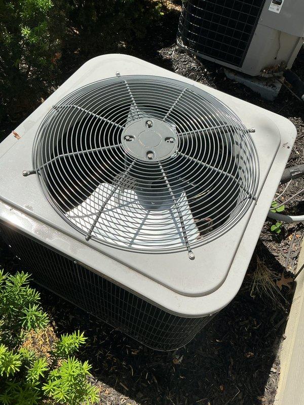 Completed comprehensive tune-up service on two residential air conditioning units, including a 2-year-old system with basement coil configuration. Performed thorough inspection of both outdoor condensing units, verified proper fan operation and protective guard integrity, and assessed overall system condition. Conducted additional inspections of thermostat functionality, humidifier operation, and Navien tankless water heater to ensure all mechanical systems were operating within manufacturer specifications.