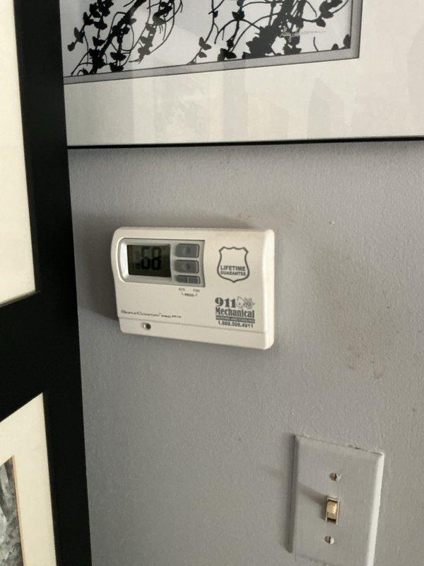 Completed full system HVAC estimate for 30-year-old residential heating and cooling equipment with cracked heat exchanger identified in basement-located air handler. Inspected exterior condenser unit and interior components, documented existing system configuration with thermostat controls, and provided comprehensive replacement quote for complete system upgrade due to age and compromised heat exchanger safety concern.