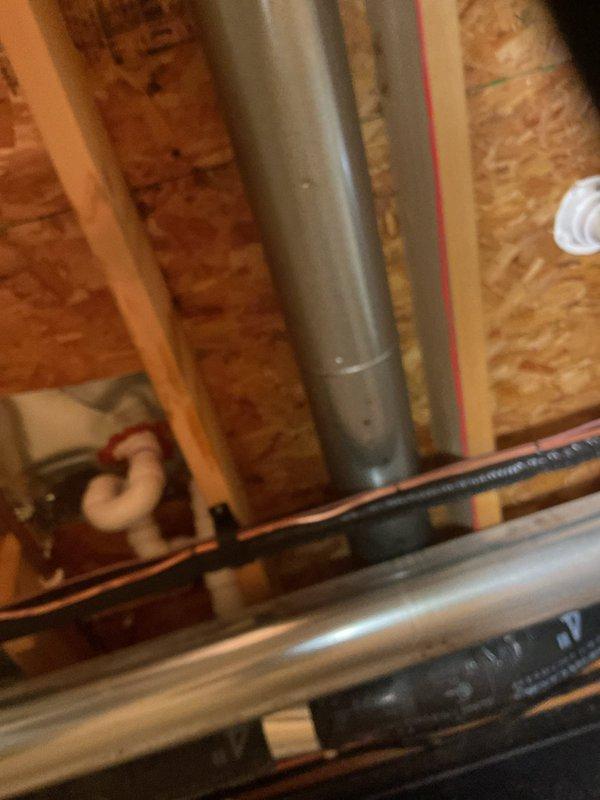 Responded to a water leak originating from the ground floor and manifesting in the basement. Performed diagnostic inspection to locate the source of the leak, which was traced to compromised plumbing lines in the first-floor bathroom area above the basement. Accessed the affected plumbing system through the basement ceiling to identify a burst section of copper supply line. Shut off the water supply, removed the damaged pipe section, and installed new copper piping with proper fittings and connections. Pressure tested the repaired system to ensure leak was eliminated and restored full water service to the residence.