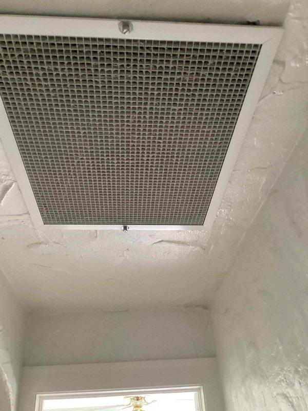 Completed comprehensive AC system inspection and replacement estimate for residential property. Inspection included attic-mounted equipment requiring ladder access, assessment of existing ductwork system with reflective insulation in basement/crawl space area, and evaluation of ventilation components including ceiling-mounted return air grille showing filter contamination. Documentation captured existing HVAC infrastructure, metal ductwork conditions, and mechanical components to provide accurate replacement recommendations.