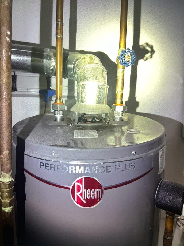 Completed semiannual Gold AC inspection on 9-year-old air conditioning system at condo location with outdoor unit accessed from behind building. Performed comprehensive tune-up including system evaluation, refrigerant level check, electrical connections inspection, and condenser coil cleaning. Replaced air filter and humidifier pad as requested, verified humidistat control settings and proper operation of humidity control system mounted on ductwork. All components tested and operating within normal parameters; system ready for cooling season.
