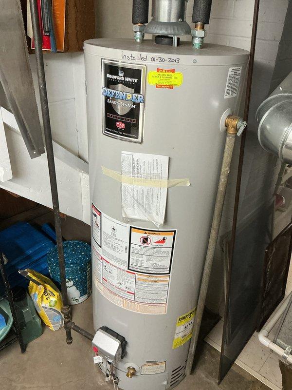 Completed comprehensive Gold AC inspection on 11-year-old residential air conditioning system with air handler located in basement. Performed full system evaluation including condenser unit examination, verified proper operation of all components, checked refrigerant levels, inspected electrical connections, and assessed overall system performance. Unit found operating within normal parameters with condenser properly maintained and surrounding area clear of debris.