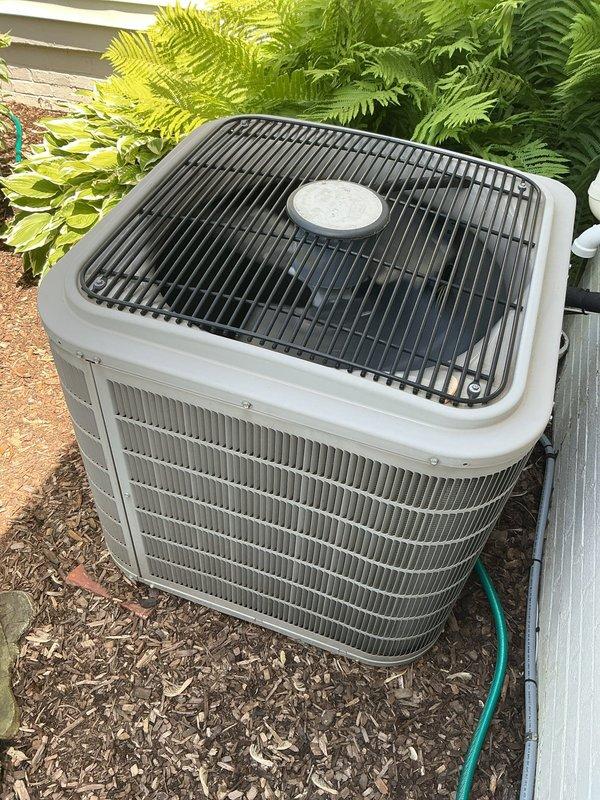 Completed comprehensive Gold AC inspection on 11-year-old residential air conditioning system with air handler located in basement. Performed full system evaluation including condenser unit examination, verified proper operation of all components, checked refrigerant levels, inspected electrical connections, and assessed overall system performance. Unit found operating within normal parameters with condenser properly maintained and surrounding area clear of debris.