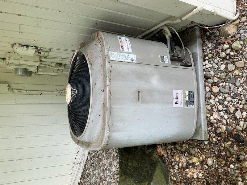 Performed routine AC tune-up on outdoor condensing unit. Completed standard maintenance inspection including cleaning condenser coils, checking refrigerant levels, testing electrical connections, and verifying proper system operation. Unit showed signs of age with surface rust but operated within normal parameters with no immediate repairs required.