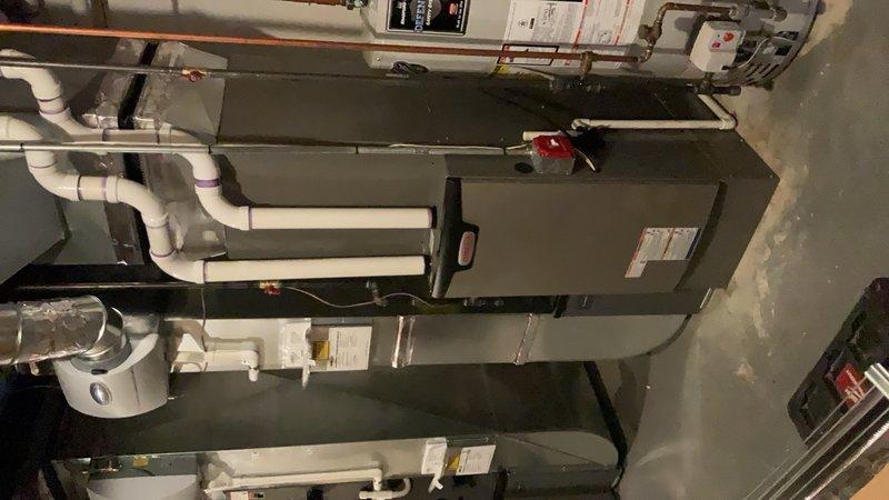 Completed full HVAC system installation on second floor including new furnace with base assembly and air conditioning unit. Installed S40 smart thermostat with programmable temperature controls and connectivity features. System includes integrated humidifier unit with proper drainage routing via white PVC piping. All refrigerant lines, electrical connections, and control wiring professionally installed and tested. Permit requested and utility rebate applications submitted for energy-efficient equipment qualifying for consumer and utility company incentive programs.