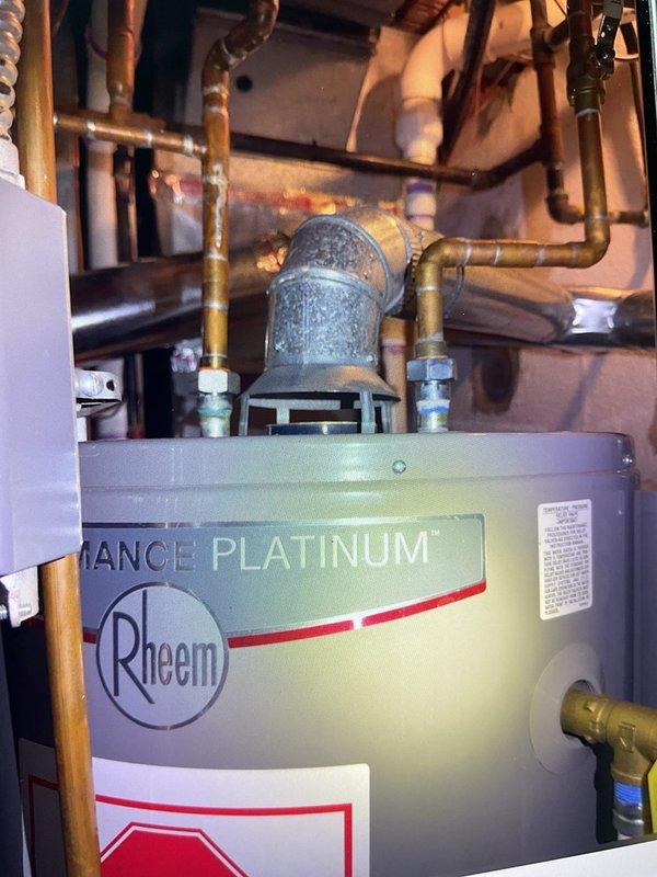 Responded to service call for Rheem Performance Platinum gas water heater that failed to ignite following utility gas service interruption. Upon arrival, performed diagnostic inspection of the unit's combustion system and gas supply. Verified gas supply was restored and flowing properly to the appliance. Inspected burner assembly through viewing port and confirmed proper ignition sequence. Checked pilot light operation and main burner flame pattern, observing characteristic blue flames with proper combustion characteristics. Verified all safety controls and gas valve operation. Tested temperature and pressure relief valve functionality. Inspected water connections at dielectric unions and confirmed no leaks present. Cycled unit through complete heating sequence to ensure reliable operation. Water heater restored to full operational status with proper flame characteristics and temperature control.