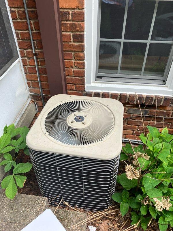 Completed comprehensive estimate for full HVAC system replacement of existing 20-year-old air conditioning equipment. Evaluated outdoor condenser unit positioned on concrete pad against brick foundation and corresponding attic-mounted air handler. Documented current system configuration, assessed installation requirements, and photographed existing equipment placement and surrounding conditions to provide accurate replacement proposal for new cooling system.