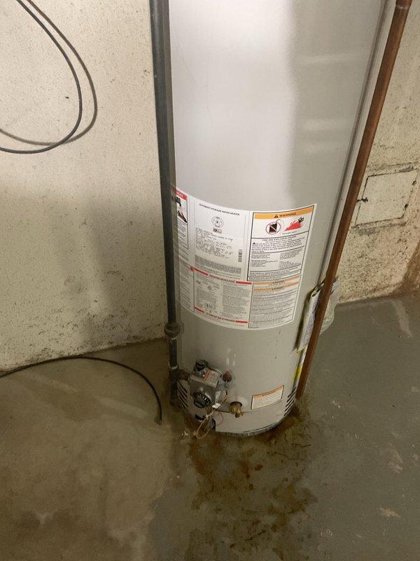 Installed 40-gallon Lochinvar tanked water heater in basement utility area. Completed all plumbing connections including copper supply lines with brass fittings and shut-off valves, installed gas line connections, and connected flue vent system. Tested all connections for proper operation and verified system functionality upon completion.