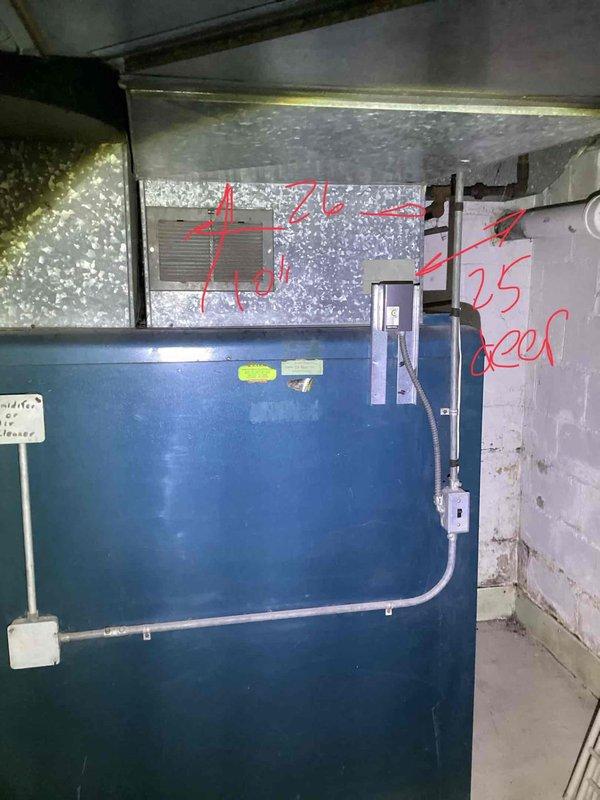 Conducted comprehensive site assessment for complete HVAC system replacement including furnace, air conditioning, and generator installation. Property currently lacks central air conditioning and existing furnace is significantly aged beyond serviceable life. Documented existing equipment conditions, utility locations marked with spray paint indicators, and evaluated installation pathways for new system components. Photographed current air handler unit showing severe frost accumulation on ductwork indicating possible refrigerant issues or airflow restrictions. Assessed electrical service capacity, outdoor unit placement options along fence line near existing utility connections, and determined optimal routing for new condensate drainage lines. Prepared detailed estimate for full system upgrade to meet customer's heating, cooling, and backup power requirements.