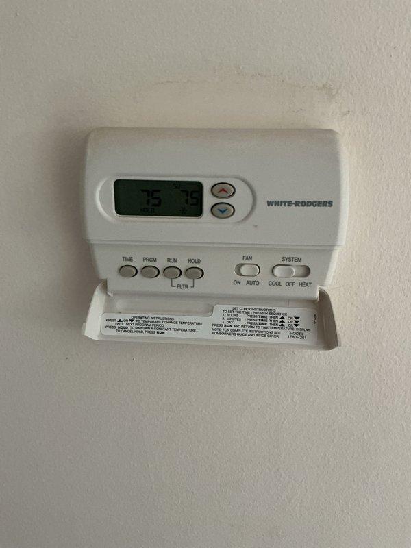 Responded to warranty call for one-month-old cooling system producing banging noise every 5-10 minutes upon startup. Inspected basement-installed HVAC equipment including air handler and associated components. Evaluated White-Rodgers programmable thermostat operation and system cycling patterns. Documented equipment configuration with furnace/air handler unit, condensate pump assembly, and PVC drainage connections. Identified and resolved mechanical issue causing intermittent noise during compressor engagement. Verified proper system operation, confirmed quiet startup cycles, and tested thermostat programming functionality to ensure normal cooling performance.