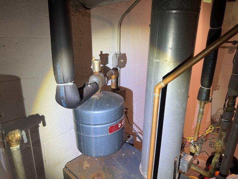 Performed comprehensive boiler inspection in basement mechanical room for new homeowner. Conducted visual assessment of boiler system, expansion tank, venting components, and associated plumbing connections. Verified proper operation of heating equipment, examined ductwork connections, inspected gas piping and safety controls, and documented system condition with photographs for homeowner records.