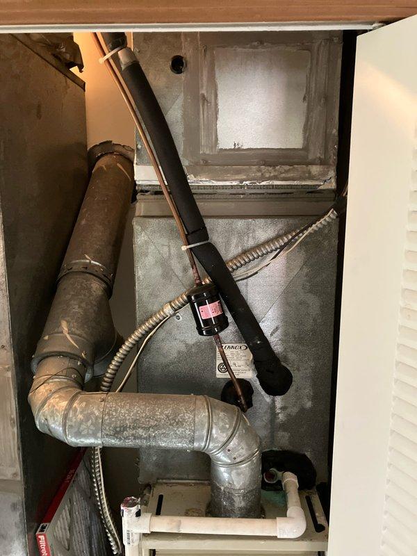 Performed comprehensive evaluation of dual-zone residential cooling system with two outdoor condensing units and corresponding indoor air handlers. The primary system, over 20 years old, and secondary system at 7 years old were both experiencing reduced cooling capacity and inadequate temperature control. Conducted thorough inspection of both indoor evaporator coil assemblies, ductwork connections, refrigerant lines, condensate drainage systems, and electrical connections. Documented existing equipment conditions including furnace integration, air handler configurations, metallic ductwork routing, and overall system layout through detailed photographic assessment. Assessed airflow patterns, component wear, and system performance limitations. Provided detailed estimate for complete HVAC system replacement including removal of aging equipment, installation of new high-efficiency units, proper refrigerant line sets, electrical upgrades, thermostat controls, and ductwork modifications as n